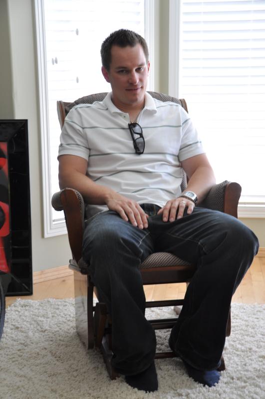 Kevin sitting in the rocker in Cathy's livingroom.