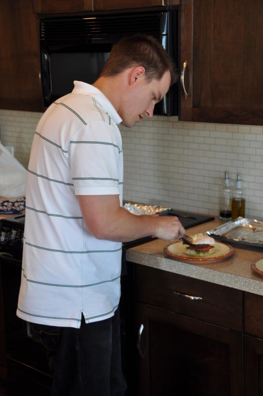 Kevin putting finishing touches on the main course salmon entree.