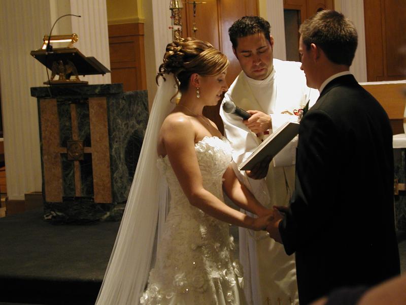 Stehpanie and Kevin taking their marriage vows.