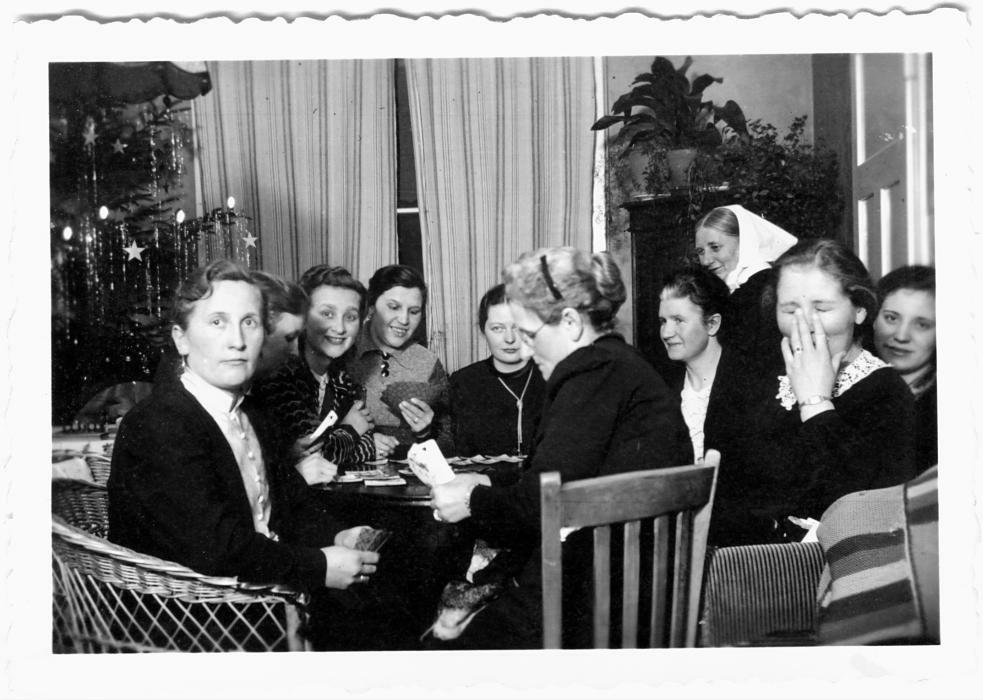 Ladies playing cards, around Christmas - could be at sanatorium