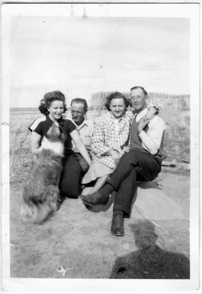 Sophie, unknown person, unknown person, John, and, of course, Frank's dog licking Sophie's face