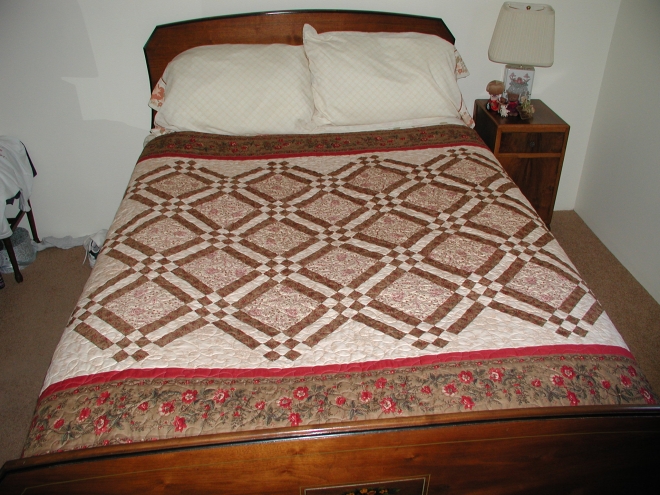 A decadent quilt in fresh raspberry & cream covered with chocolate.