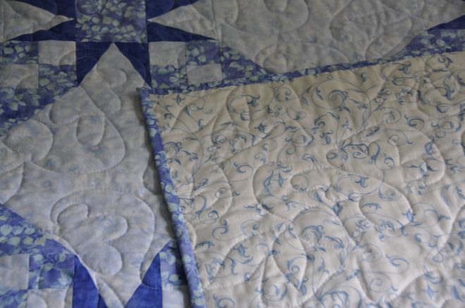 Close up of the backing fabric, and quilting pattern, of the Tennessee Waltz in Blue.