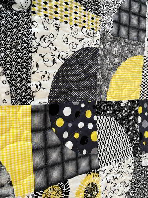 Close up of some of the fabrics and blocks.