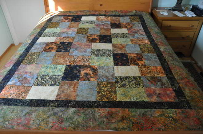 Quilt 'Cheaper by the Dozen' made using 'Batik Morocco' fabrics.