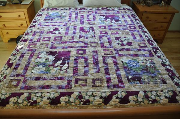 Crane Paradise quilt, wine coloured background version.