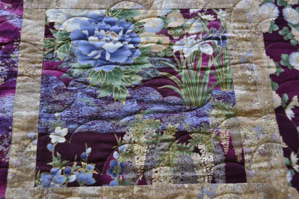 Close up of iris block on Crane Paradise quilt.