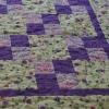A Four Patch quilt in violet - elegant. Completed spring 2010.