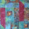 An art quilt in batiks with a fruity, seashore palette.
