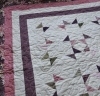 A soft, antique looking quilt, Confetti.