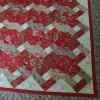 French Twist, a quilt in reds and beiges. Kit from A Quitled Garden, by Catherine.