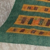 Lap quilt in greens and golds, made from kit purchased in Lethbridge, Alberta in September 2005.