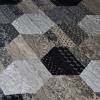 A striking geometric quilt in black, tan and white. From the pattern Strip Lash by GE Designs